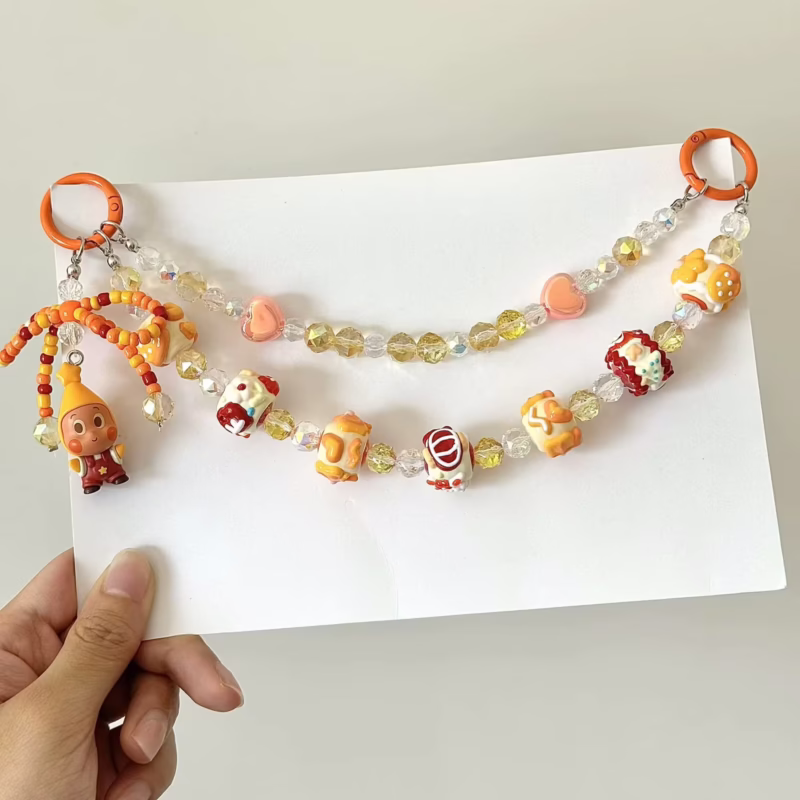 Unlock your playful side with the Pop Bean Skullpanda DIY Handmade Phone Rope! Featuring cute collectible nuts