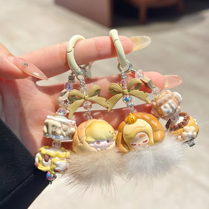 Skullpanda’s New Pop Bean Baked Bread DIY Fluffy Plush Ball Phone Chain brings the magic of fresh-baked charm into